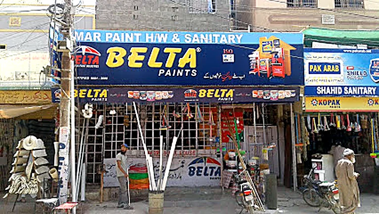 Umar Paint Hardware & Sanitary shop front — paint stock and PVC pipes displayed outside the shop